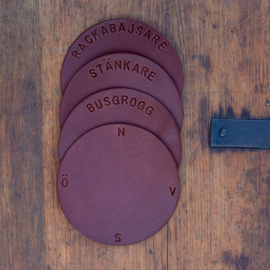 Glasunderlägg i äkta läder