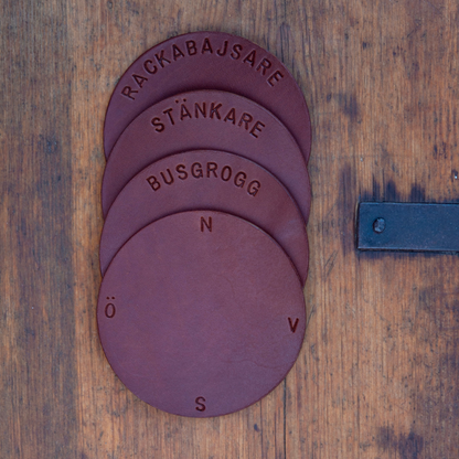 Glasunderlägg i äkta läder